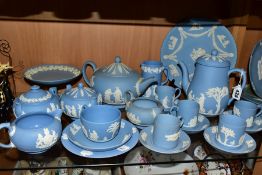 WEDGWOOD PALE BLUE JASPERWARES, comprising a pear shaped coffee pot, five coffee cans and saucers, a