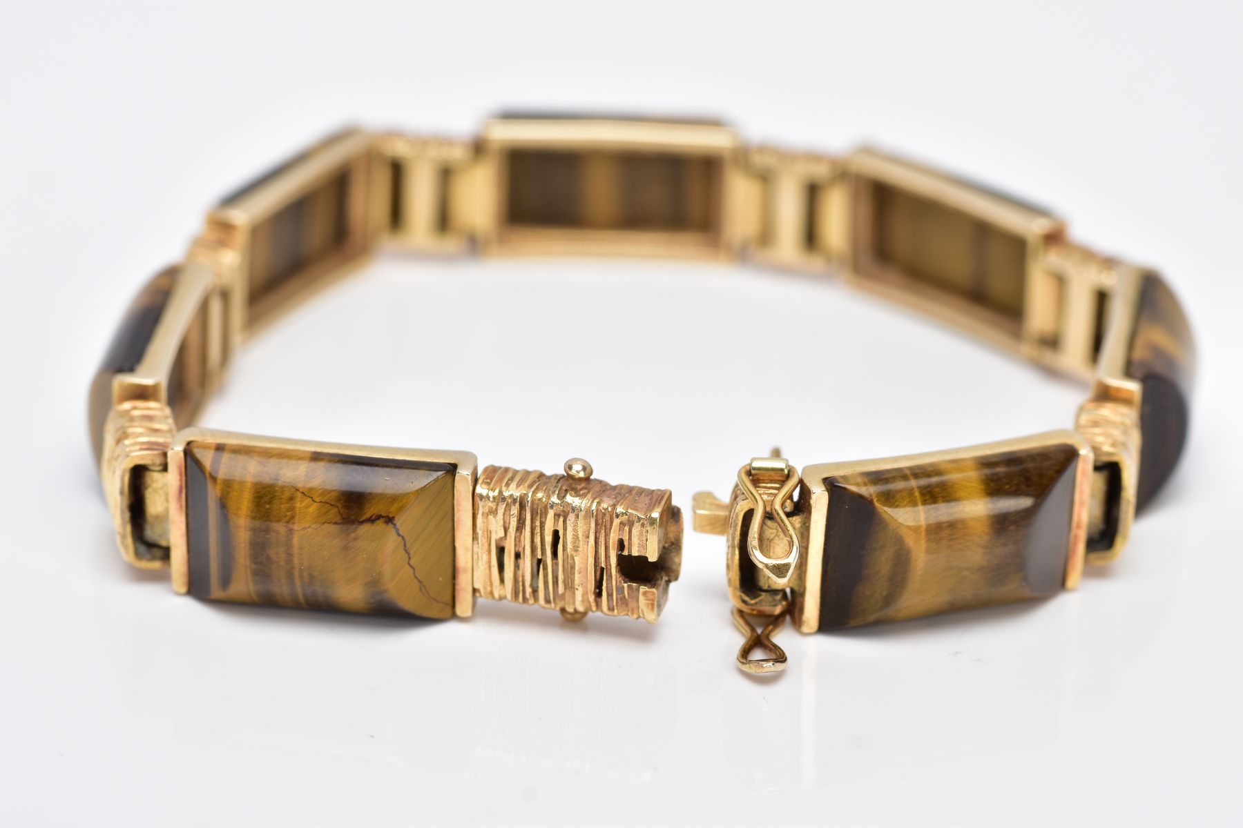 A 9CT GOLD TIGERS EYE LINE BRACELET, designed with seven rectangular shaped links set with - Image 2 of 5