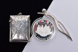 A SILVER VESTA, BROOCH AND A COMMEMORATIVE COIN, the vesta of a rectangular form, engraved foliate