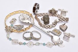 A BAG OF ASSORTED ITEMS, to include a white metal square designed diamond ring, set with single