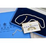 A CULTURED PEARL NECKLACE, individually knotted on a white cord, each pearl approximately 4.6mm,