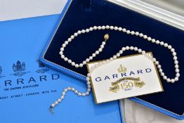 A CULTURED PEARL NECKLACE, individually knotted on a white cord, each pearl approximately 4.6mm,