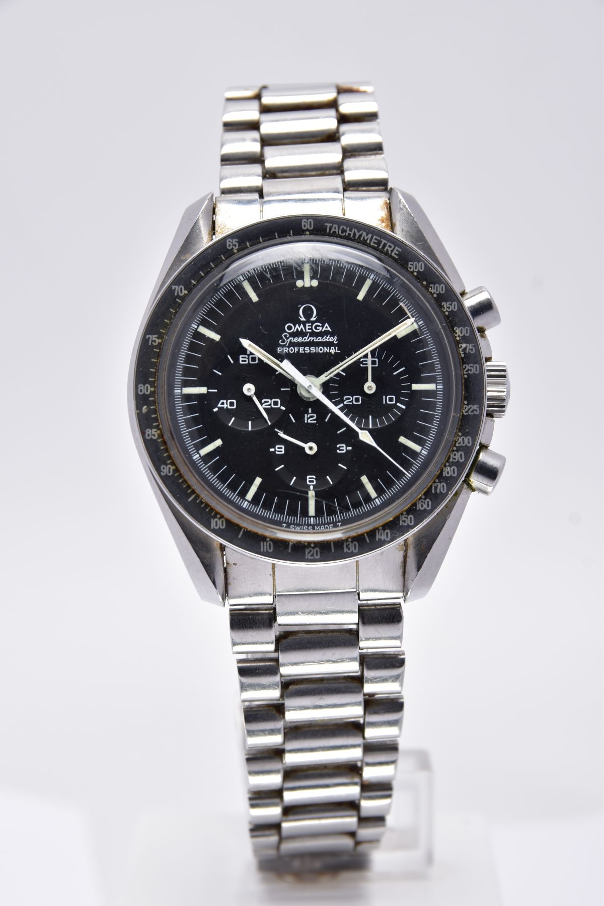AN OMEGA SPEEDMASTER PROFESSIONAL MOONWATCH black dial with luminescent baton markers, black