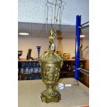 A LATE 19TH CENTURY ORMOLU TABLE LAMP OF URN FORM, with seated Putti holding a garland and flowers