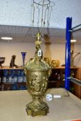 A LATE 19TH CENTURY ORMOLU TABLE LAMP OF URN FORM, with seated Putti holding a garland and flowers