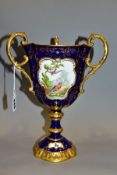 AN EARLY 20TH CENTURY COALPORT PEDESTAL CUP TYG, the blue and gilt ground painted with a vignette of