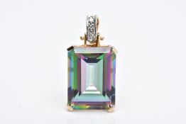 A YELLOW METAL GEM SET PENDANT, of a rectangular form with a claw set emerald cut, mystic coated