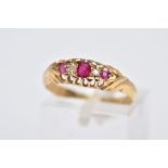 AN EARLY 20TH CENTURY 18CT GOLD BOAT RING, designed with a central oval cut ruby interspaced with