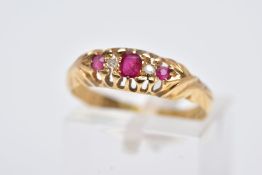 AN EARLY 20TH CENTURY 18CT GOLD BOAT RING, designed with a central oval cut ruby interspaced with