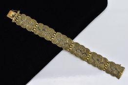 A SILVER GILT MARCASITE WIDE LINK BRACELET, designed with six wavy edge textured links, set with