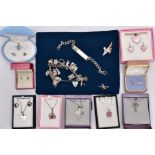 A BOX OF ASSORTED SILVER AND WHITE METAL JEWELLERY, to include a silver charm bracelet suspending