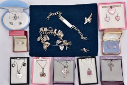 A BOX OF ASSORTED SILVER AND WHITE METAL JEWELLERY, to include a silver charm bracelet suspending