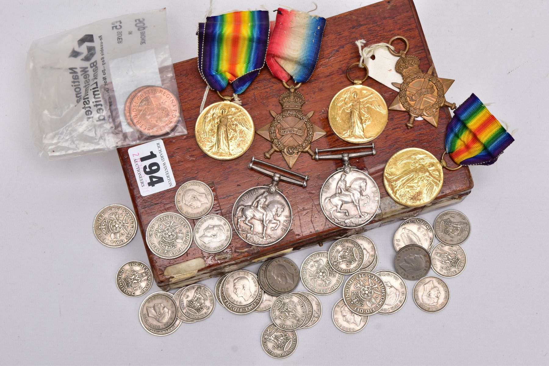 A BOX CONTAINING SOME BRITISH COINAGE AND MEDALS GROUPS comprising British War & Victory medal, pair