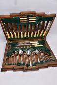 AN ART DECO OAK CASED CANTEEN OF SILVER PLATED CUTLERY, for six settings, ivorine handles,