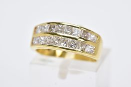 A MODERN 18CT GOLD DOUBLE ROW DIAMOND RING, two rows of princess cut diamonds slightly tapering in