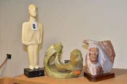 A 20TH CENTURY RAYMOND PETTIGREW CARVED STONE BUST OF A NATIVE AMERICAN INDIAN AND AN EAGLE, mounted