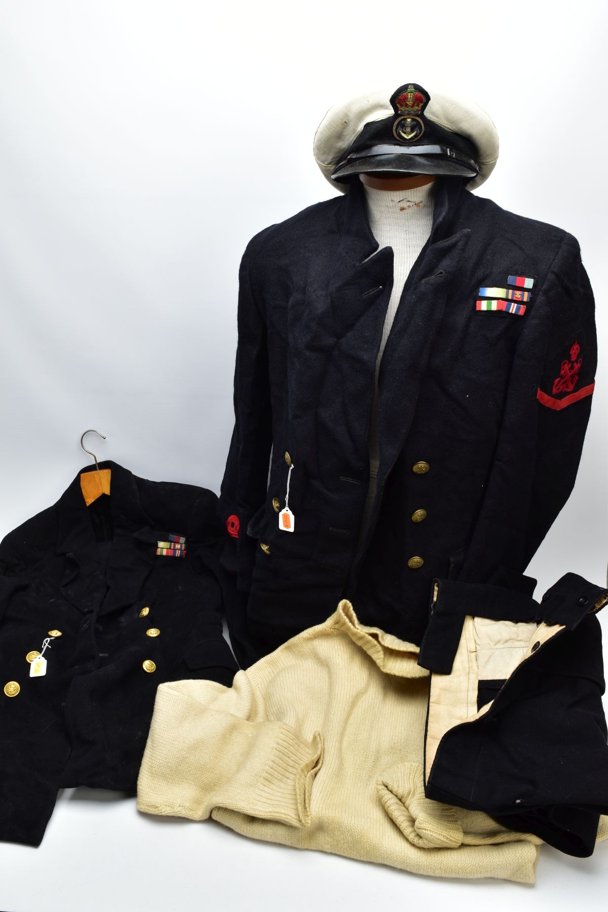 TWO x BRITISH ROYAL NAVAL UNIFORMS, jackets and trousers, one also has the traditional off white