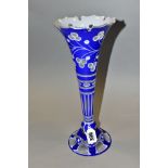 A LATE 19TH CENTURY BOHEMIAN GLASS TRUMPET SHAPED VASE, crenellated rim above blue and white cut