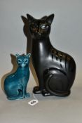 TWO POOLE POTTERY CATS, comprising a seated black cat with glazed striped pattern, height 29cm and a