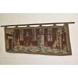 A 20TH CENTURY MACHINE WOVEN TAPESTRY WALL HANGING AND POLE, depicting a Dutch interior scene with