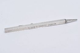 A PROPELLING RULER PENCIL, engraved 'Lloyd P Cavett 12-28-39, stamped 'sterling', approximate