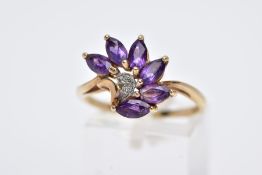 A 9CT GOLD AMETHYST AND DIAMOND RING, designed with a spray of six marquise cut amethysts with a