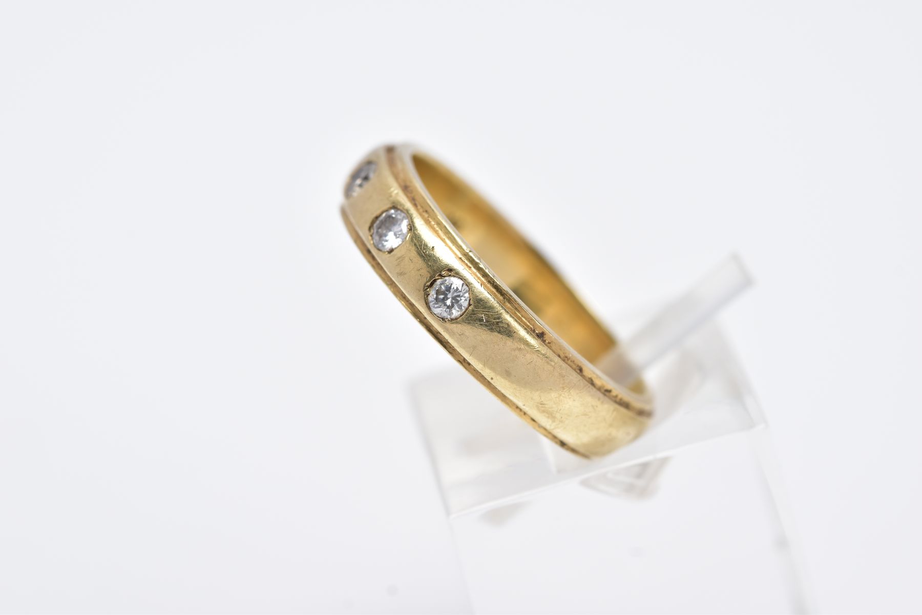 A 9CT GOLD DIAMOND BAND, a plain polished band set with five round brilliant cut diamonds, each - Image 2 of 3