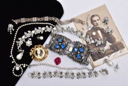 A BOX OF ASSORTED COSTUME JEWELLERY, to include a wide white metal openwork bracelet set with blue