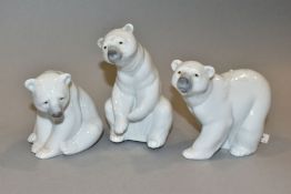 THREE LLADRO POLAR BEARS 'Attentive Polar Bear' No 1207, height 10cm, 'Resting Polar Bear' No