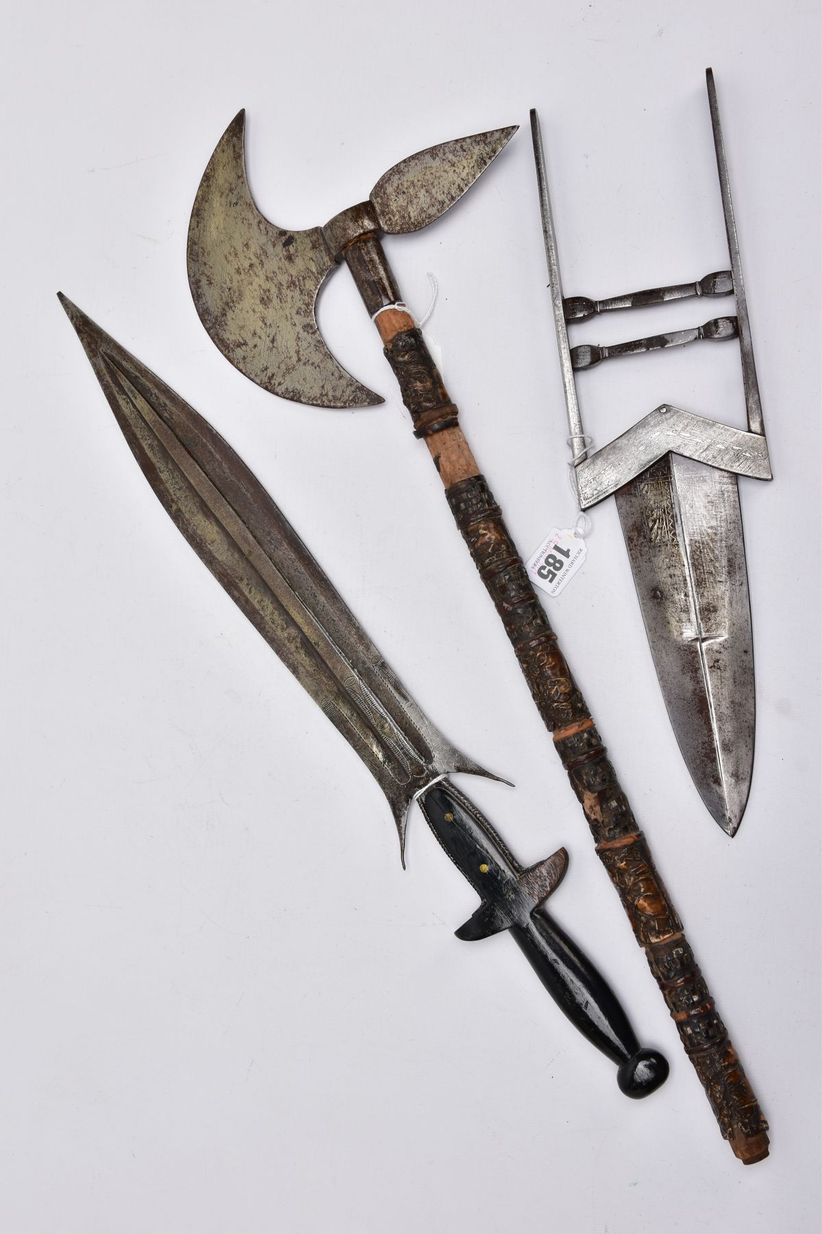 THREE BLADED WEAPONS OF EASTERN EUROPEAN/AFRICAN/ASIAN ORIGINS comprising of a small hand axe