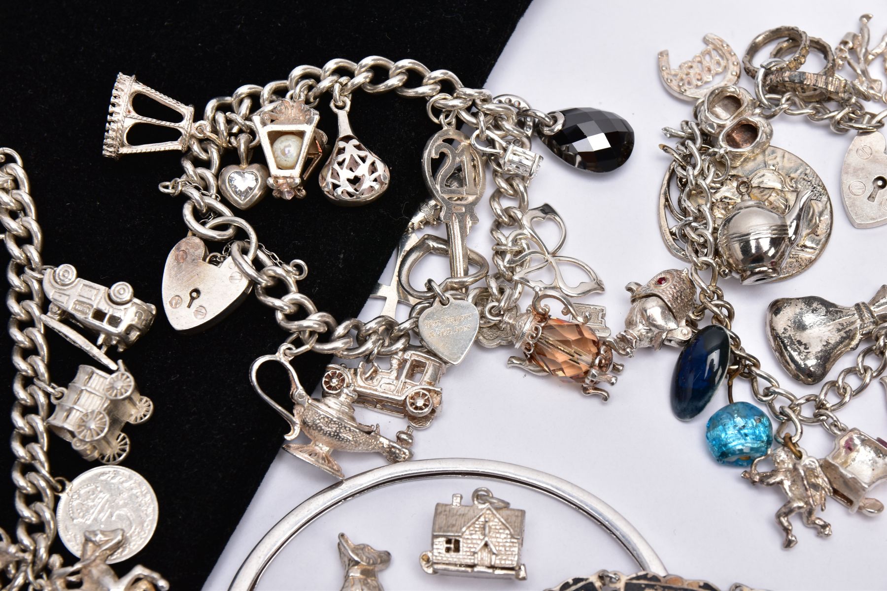 A BAG OF ASSORTED JEWELLERY, to include three white metal charm bracelets suspending charms, one - Image 6 of 7