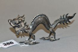 A CHINESE WHITE METAL DRAGON MENU HOLDER, bears marks to the underside of the head, length 14cm x