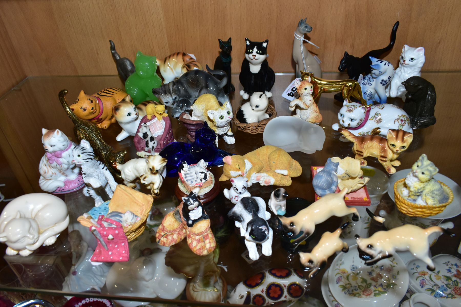 A COLLECTION OF OVER THIRTY FIVE MINIATURE CAT FIGURES, mostly ceramic and resin, including Franklin