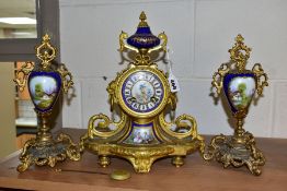 A MID 19TH CENTURY ORMOLU AND PORCELAIN MANTEL CLOCK, the case surmounted by an urn shaped finial