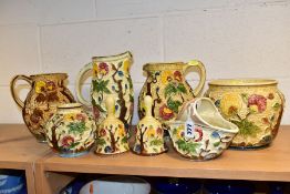 EIGHT PIECES OF H. J. WOOD RELIEF MOULDED 'INDIAN TREE' POTTERY, comprising three jugs, two bells, a