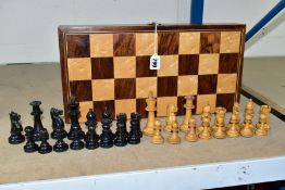 A CASED WOODEN CHESS SET, appears complete, some of the pieces have minor damage, all in lightly