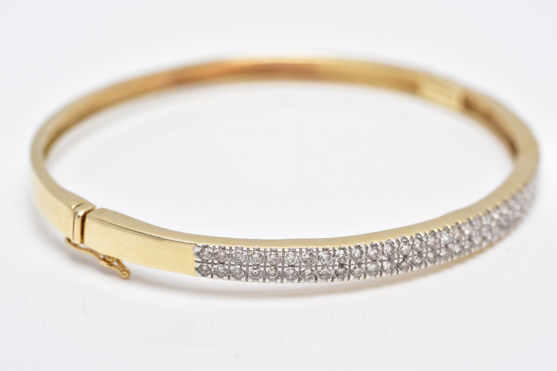 A YELLOW METAL DIAMOND BANGLE, the hinged bangle designed with two rows of round brilliant cut - Image 2 of 6