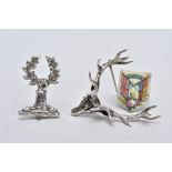 TWO WHITE METAL BROOCHES AND A JUBILEE PLAQUE, the first brooch in the form of a stag head,