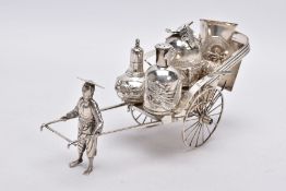 AN EARLY 20TH CENTURY CHINESE SILVER CONDIMENT SET, in the form of a street vendor pulling a cart,
