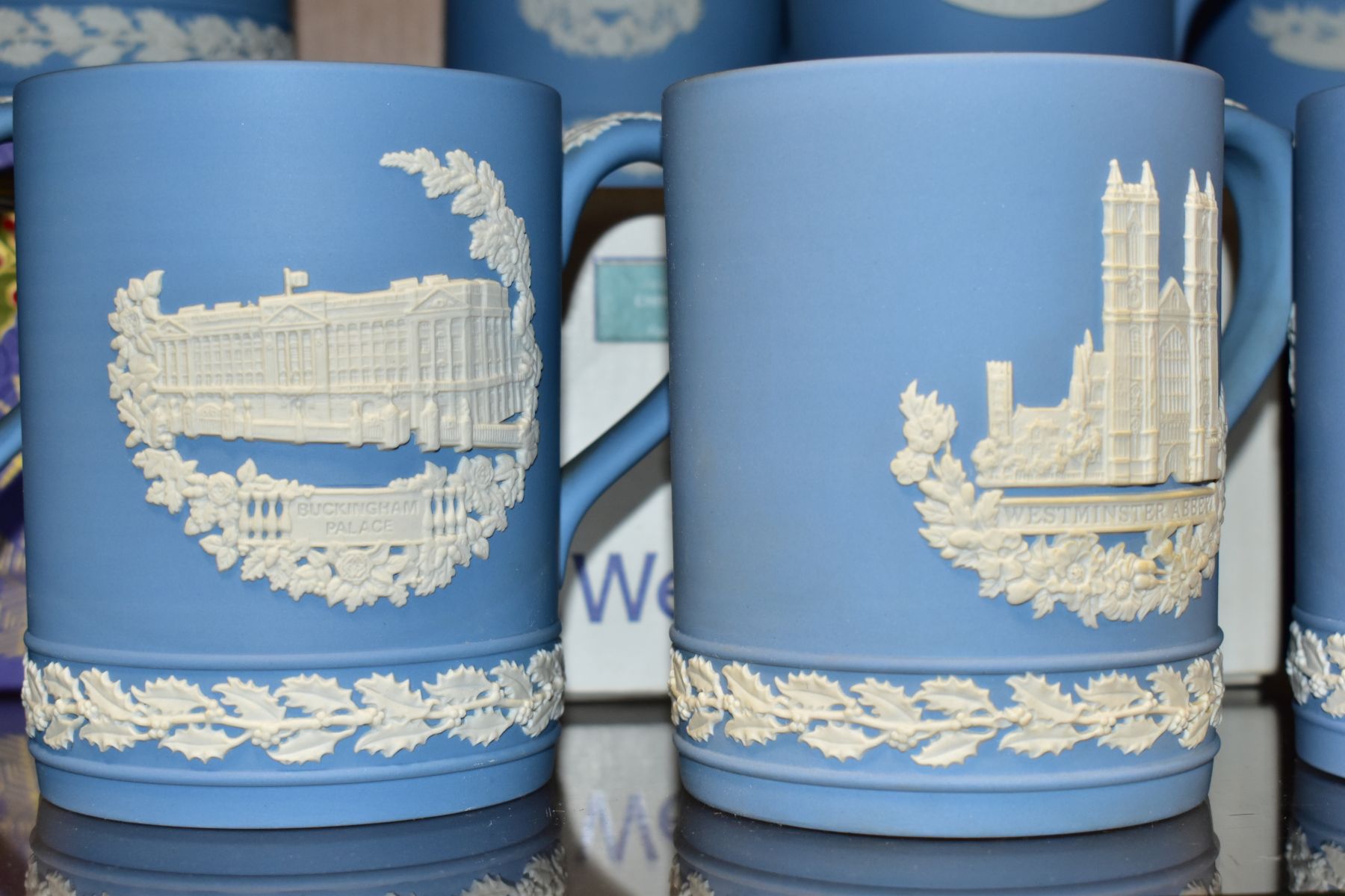 FIFTEEN WEDGWOOD PALE BLUE JASPERWARE CHRISTMAS MUGS, 1971 to 1985 inclusive, decorated with Royal - Image 7 of 9