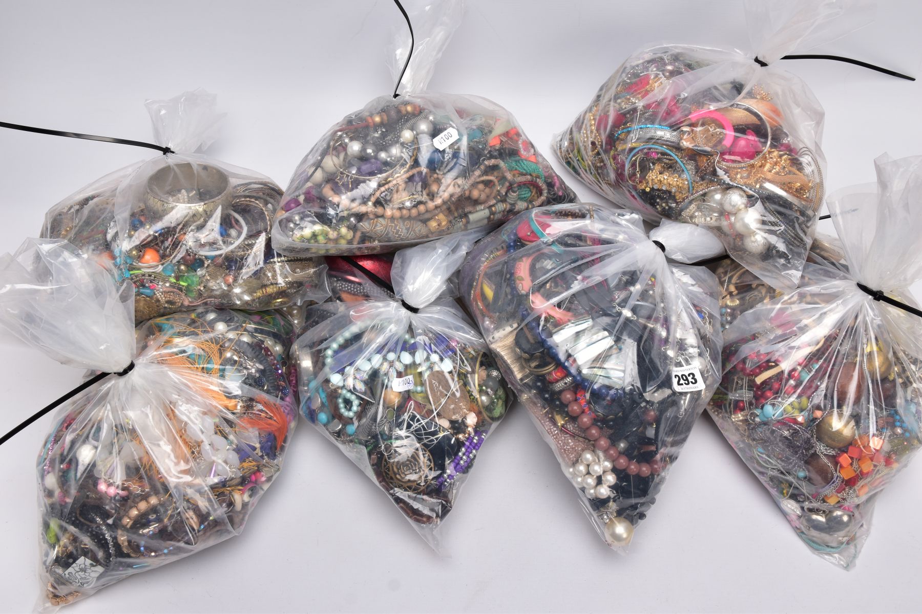 SEVEN BAGS OF COSTUME JEWELLERY, to include beaded necklaces, bangles and earrings