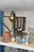 A SMALL GROUP OF LAMPS, DECANTERS, TANKARDS, etc, including a copper octagonal lantern on a