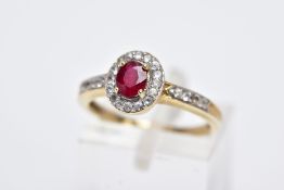 A 9CT GOLD RUBY AND SPINEL CLUSTER RING, designed with a central oval cut ruby within a circular cut