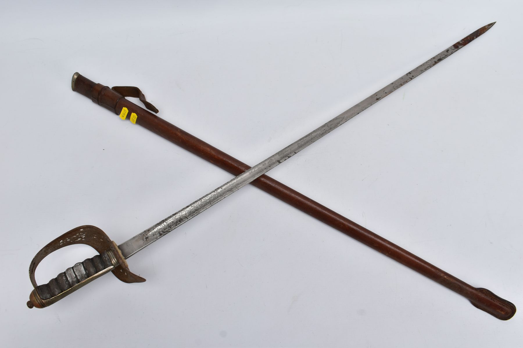 A GEORGE V BRITISH INFANTRY OFFICERS SWORD AND BROWN LEATHER SCABBARD, the blade length is