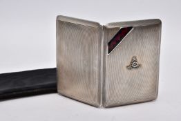 A SILVER CIGARETTE CASE, rectangular form, engine turn design, with a decorative red and blue enamel