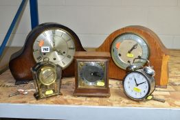 A GROUP OF FIVE CLOCKS, comprising two Smiths domed top oak cased mantel clocks, both with pendulums