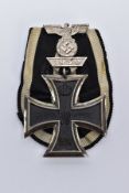 AN IMPERIAL GERMANY WWI 1813/1914 IRON CROSS 2ND CLASS, mounted on rosette style ribbon, with