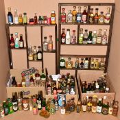 A COLLECTION OF 105 MINIATURES, to include Continental liqueurs (fifty six), one Port, one Gin, five