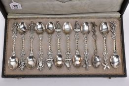 A CASED SET OF CONTINENTAL SILVER COFFEE SPOONS, to include twelve spoons four with a sail boat,