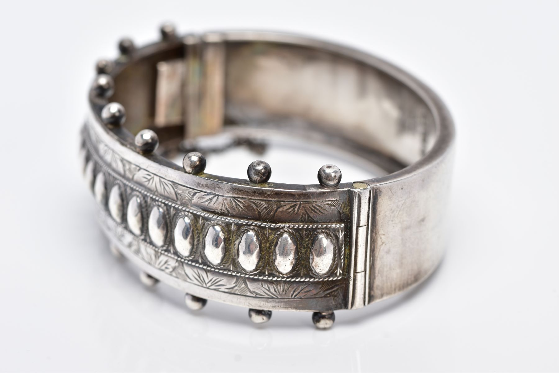 A VICTORIAN SILVER BANGLE, applied bead word decoration and half engraved, measuring 20.0mm in - Image 3 of 5